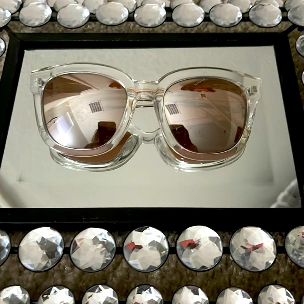 Clear mirrored chunky sunglasses.
